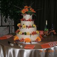 Fall Wedding Cake Colors were orange and browns. Flower girl threw leaves instead of petals. Very pretty wedding and I had fun doing their cakes.