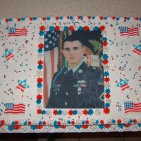 Fallen Hero This cake was made in honor of my cousin in law who died in Iraq. His picture was placed on edible paper, the flags are made from sugar, i...