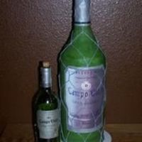 Wine Bottle Bottle is seven 6" cakes stacked, and neck is rice krispie treats, all are stacked on a dowel rod that is screwed to the bottom cake...