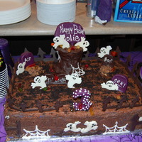 Halloween Birthday Cake! Halloween graveyard cake for my daughters 3rd birthday. Tree trunk is rice treats covered in modeling chocolate. Ghosts and fence are...
