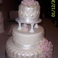 My First Wedding Cake That Is For Someone.... I was asked to do a wedding cake by my church for someone they were helping out. So I did this just for the cost of supplies. It is yellow...