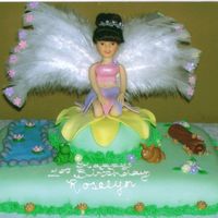 Fairy Cake I hand sculpted her entire body and outfit. The only things not edible is the head and wings.