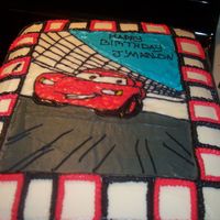Lighting Mcqueen This is a yellow cake with buttercream icing.