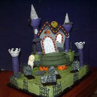 Benstin's Castle Haunted house cookie kit ,cut out and batterey operated lights stuffed inside. 3 inch globe dividers , and castle turrets are fondant...