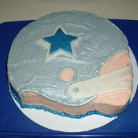 Cowboys Helmet September 2007 - This was made for my brother's b-day. Inspired by many cakes here on CC. Helmet iced in grey butter cream, then went...
