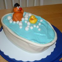Ernie's Bath August 2007 - first attempt at covering a cake with fondant and with fondant figures. "Water" is butter cream.