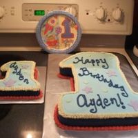 # 1 Cake For a 1 year old's birthday. The large #1 was cut from 11 X 15 cake. The smash cake was cut from an 8" round. All buttercream.