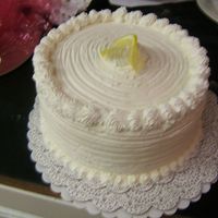 Lemon Chiffon Cake I made two of these for people requesting a lemon cake for Easter. It has Italian Merringue b/c, whipped cream border and lemon curd...