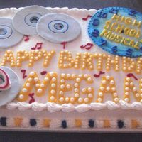 High School Musical 2 I did this cake for my niece. I cut the CD's and the clock from rolled MM fondant. I brushed the clock with blue food coloring and...