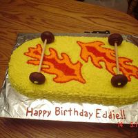 Skateboard Cake for 10 yr old boy who wanted flames on it. Personally, I think they look like leaves but hey the mom liked it. I used tip 16 for the...