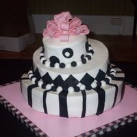 100_2297.jpg I wasn't able to get a picture of the cake once the bottom border was on. It looked much better with it. Buttercream with fondant...