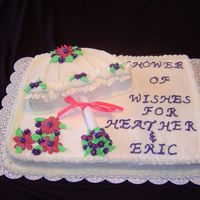 Umbrella Wedding Shower I made a sheet cake and placed a 9" round cut in half on top. It is one of my first cakes.