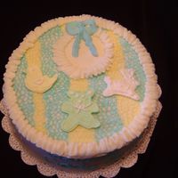 Baby Bib This cake was made to look like a baby bib. The fiqures were made out of colorflow.