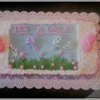 It's A Girl! this was for a baby shower...yellow wet cake with buttercream icing... marshmallow booties