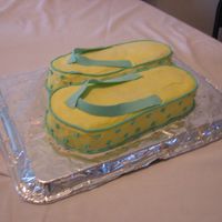 Flip Flop Cake This was a cake for my two friends, and they loved it!! I used fondant for the straps and icing for the rest of the cake. I made the...