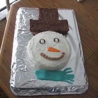 Snowman Cake This was a snowman cake that I made. I used rice krispies for the hat. Then I covered the rice krispies with chocolate.