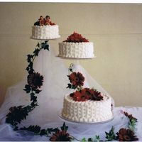 Baskets Of Gerbers Basketweave cake on stands with gerber daisies.