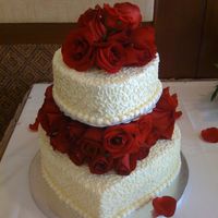 Img_0455.jpg The bride just stated she wanted a heart shape cake and something red on it, and this is what I came up with. A simple one as the bride...