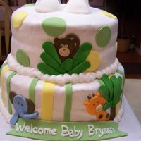 Jungle Baby Stacked cake covered with buttercream icing and fondant accents