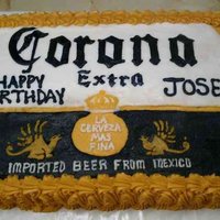 Corona Beer This cake is covered with buttercream icing. The writing and logo is all free-handed