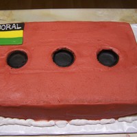 Boral Brick This is a 7x11 cake made for someone who works at the Boral brick company.. Icing is buttercream. I added fondant for the holes.