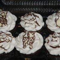 Baby Shower Cupcakes Choc and white cupcakes frosted in buttercream or choc buttercream. Topped with a choc transfer zoo animal for a baby shower.