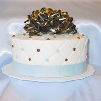 Happy Birthday In Blue And Brown White and choc cake iced in buttercream for DH birthday. Used an impression mat on the sides and bought a bow for the top. 6" 2 tier...