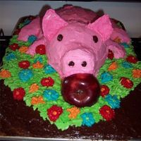 Roasted Pig Front Front of my roasted pig. I used a stainless steel bowl for the body, a small Pyrex bowl on its side for the head, a trimmed cupcake for the...