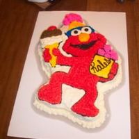 100_5949_Custom.jpg This is an Elmo birthday cake, made with butter cream frosting.