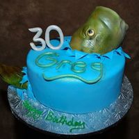 Catching Fish This cake was great fun! Catching a fish. The fish head has a foam core with gumpaste and then covered in fondant and spray painted.