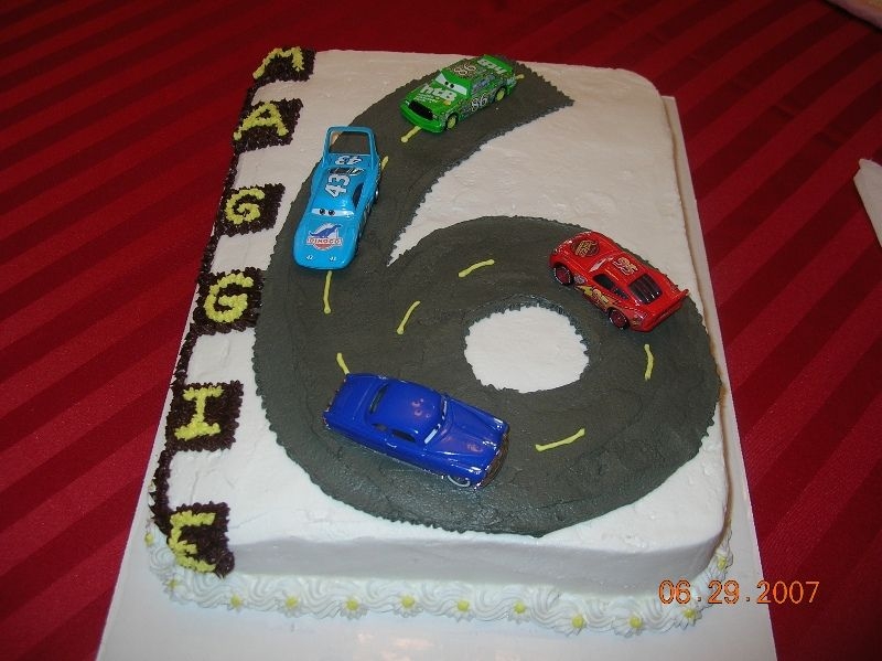 Car's Cake 6 Year Old Chocolate cake with buttercream icing. Looks kind of plain--but I didn't have a lot to go on for this cake. I hope they like it.