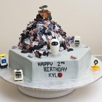 Wall-E I made this cake for my cousin's son. Characters purchased at disney store. Buttercream icing, and trash is made out of crinkled...