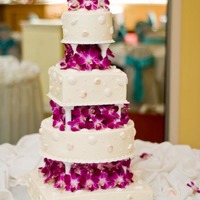 Seashells And Orchids White chocolate seashells with pearl dragees. Real orchids between each tier