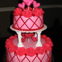 Course 3 Final Cake Tonight I made my final cake for course 3. I covered it in MMF, roses are made of royal icing, hearts made of color flow, both covered in...