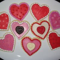Valentine Hearts Just some more no-fail cookies, with Toba's and antonia74's icing. I made the heart candies with candy melts and a Wilton lolipop...