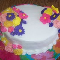 Flowers I WAS PLAYING AROUND WITH THIS CAKE. I DID END UP PUTTING LEAVES AND A BORDER ON IT...