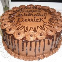 My Husband's Birthday Cake chocolate b/c icing and chocolate ganache. german chocolate cake with pecan coconut filling.