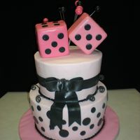 Dice Birthday cake for a young girl turning 10 who loves board games, thus the dice. WASC iced in buttercream with fondant accents. One of the...