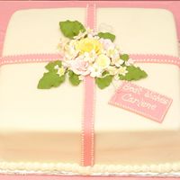 My First Fondant Cake. This was my first attempt using fondant. I've never taken lessons...I know I should! I bought some of the gumpaste flowers and made...