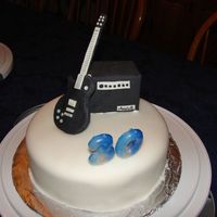 Les Paul Guitar With Marshall Amp For Brother-in-law's b-day. Fondant covered cake, gumpaste guitar and amp. I made the amp by covering a small box with gumpaste. The...