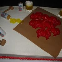 Maryland Crab And Beer Cake The cake is marble, iced in buttercream. The brown "paper" and crab mallets are fondant, the crabs are candy melts, the beer cans...