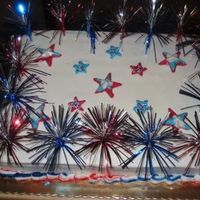 Fourth Of July I made this cake for my office's monthly birthday celebration. The stars are made of candy melts and the small stars have nonparels on...
