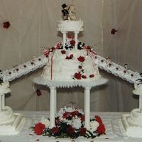 Red Rose Wedding Cake Here is a picture of a wedding cake that me and my sister did together. We made all the flower arrangments and decorated the cake. It was a...