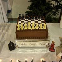 Chess Board Groom's Cake This cake 12 inch square cake has chocolate butter cream icing and the chess board is chocolate and white petinice fondant. I was going to...