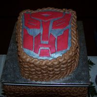 Autobot Grooms Cake Everything is butter cream except for the autobot symbol. I made everything metalic with a metalic luster dust.