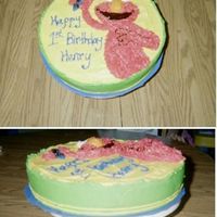 Elmo This cake is decorated w/buttercream. The fur was done with tip # to give it kinda a 3-D look. The eyes and nose were also done with a 3-D...