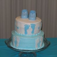 Baby Boy Booties... Made this one for my own baby shower! Buttercream with fondant footprints and store bought shoes!