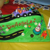 October_2006_038.jpg For my nephew's first birthday party. Long loaf cake covered in fondant. Everything else made with fondant. Took FOREVER!