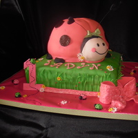 Ladybug 1St Birthday Vanilla cake with vanilla buttercream and gumpaste accents. Ladybug baked in pyrex bowl