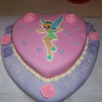Tinker Bell 2 layer heart shaped chocolate cake. Cream cheese frosting in between layers. MMF covered. Tinker Bell is FBCT. BC Roses. Due to how her...